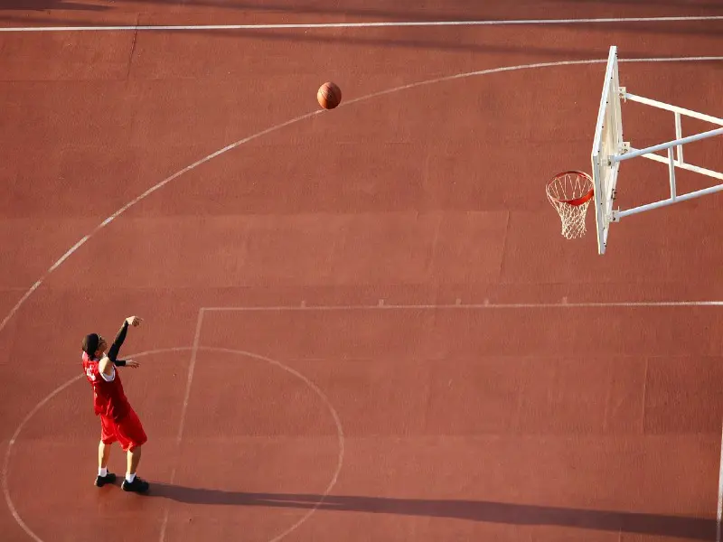 A man making a basketball shot.