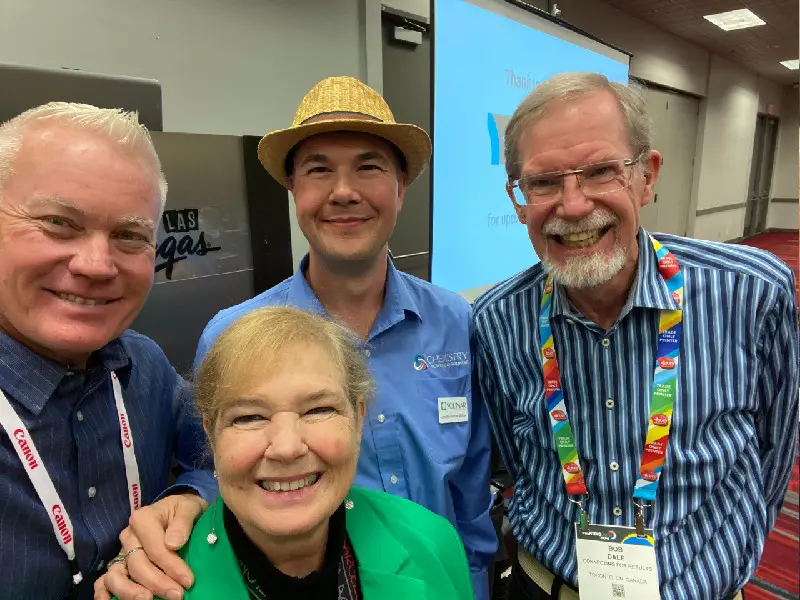 A selfie of CFR team members with friends at Printing United Expo.