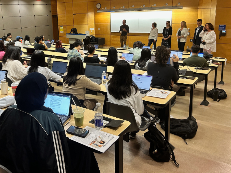 Mentors from the Print Wisdom program speaking to a classroom of Toronto Metropolitan University students during a Graphic Communications Management class.