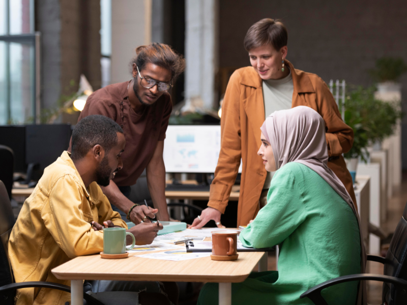 Diverse team collaborating at a modern office table