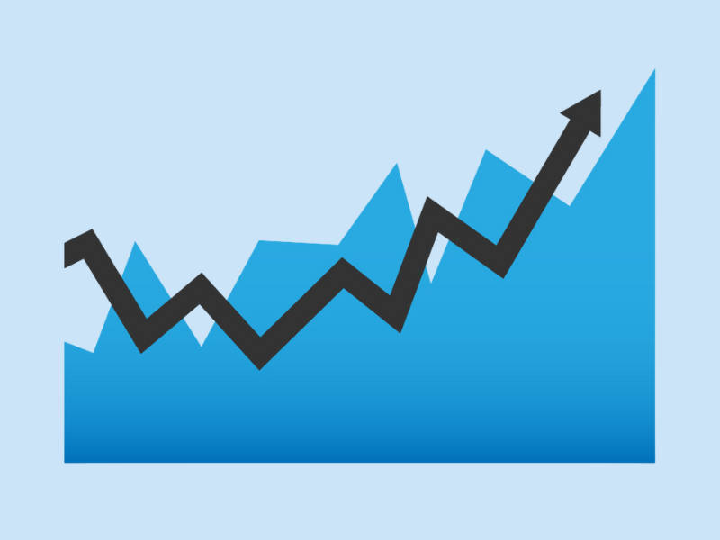 A stylized blue growth chart with a bold black arrow rising upward, symbolizing positive performance and strategic progress.