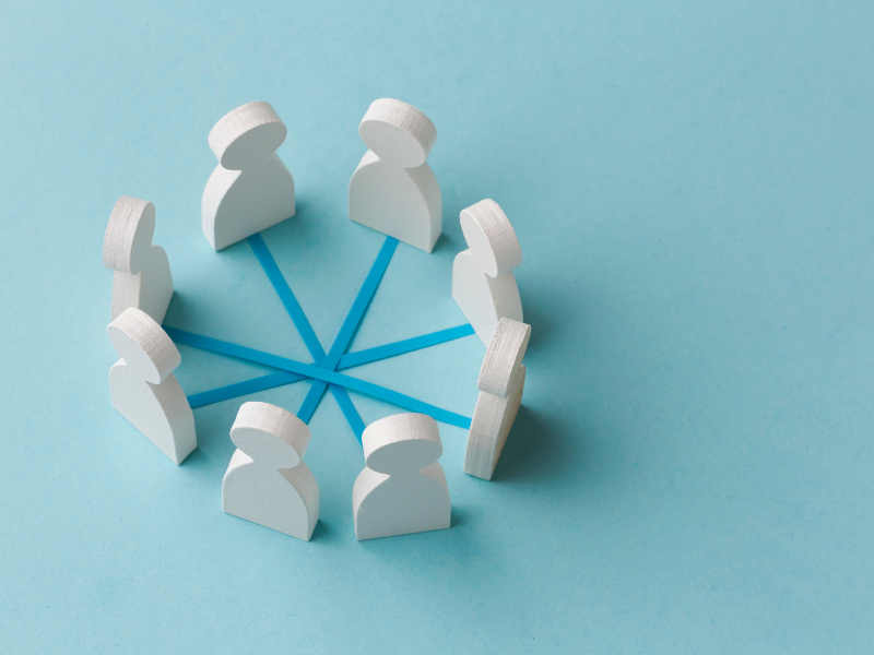 responsible business governance that holds up White figures linked in a circle, representing responsible business governance and shared accountability.